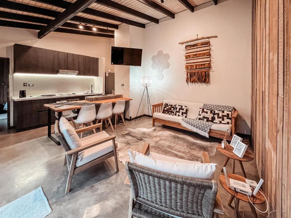 a living room with a couch and a table at apartamento campestre con terraza in Puerto Varas