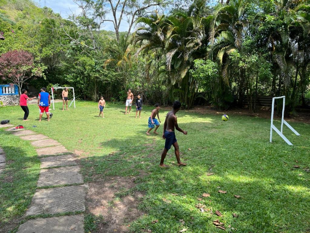 a group of people playing a game of soccer at Espaço Krisalys in Guararema