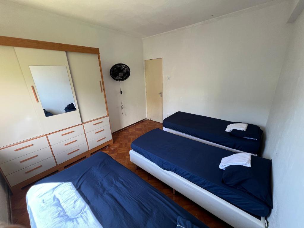 En eller flere senge i et værelse på Quarto na Pituba