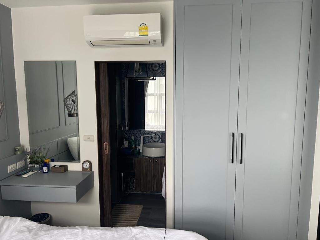 Ένα ή περισσότερα κρεβάτια σε δωμάτιο στο Palmyrah Surin Beach Residence