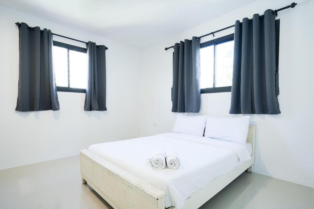 Ένα ή περισσότερα κρεβάτια σε δωμάτιο στο Snap inn Sukhumvit 1 สแนป สุขุมวิท ซอย 1 - Gold