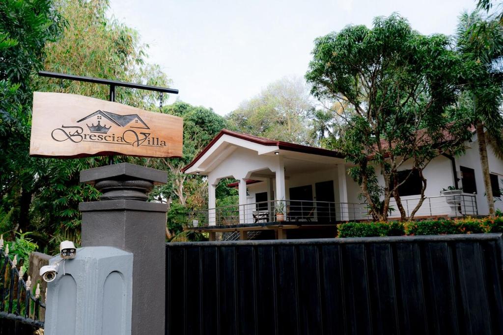 a house with a sign in front of it at Brescia villa - Your Private Escape in matara in Gandara West