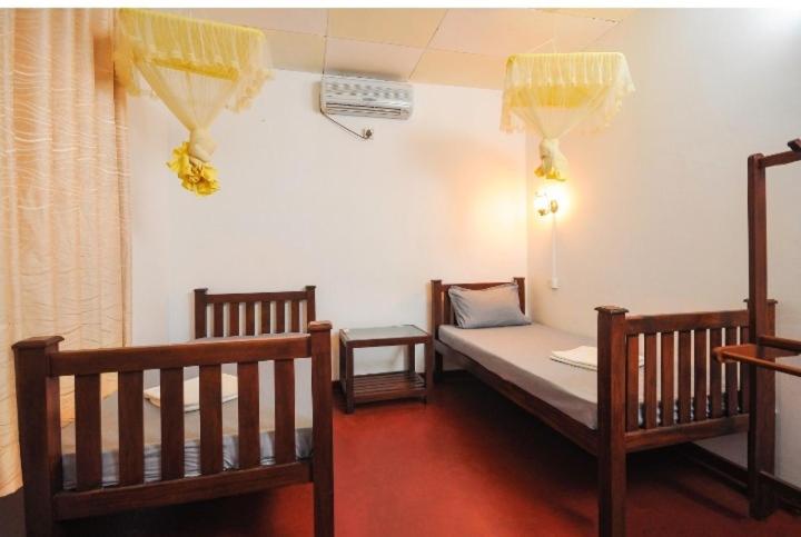 Giường trong phòng chung tại Green Villa