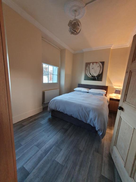 Postel nebo postele na pokoji v ubytování Petticoat House