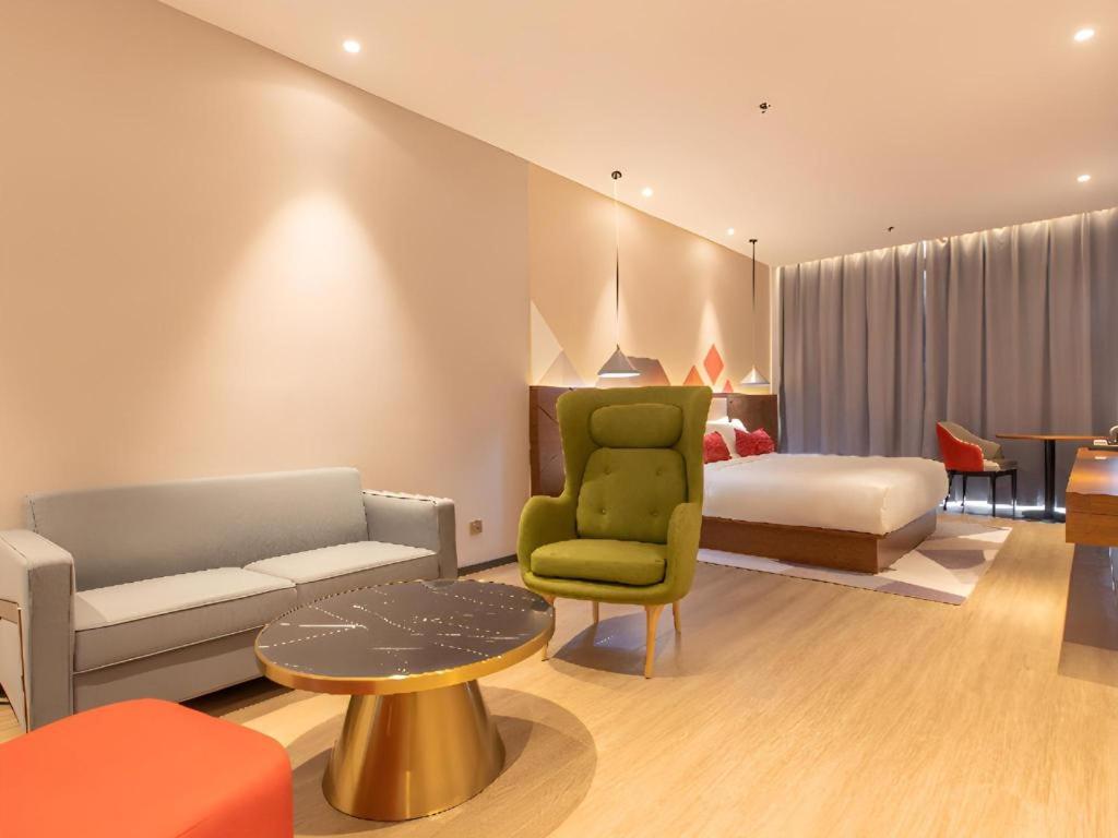 Ένα ή περισσότερα κρεβάτια σε δωμάτιο στο Borrman Hotel Guilin Railway Station Two Rivers and Four Lakes