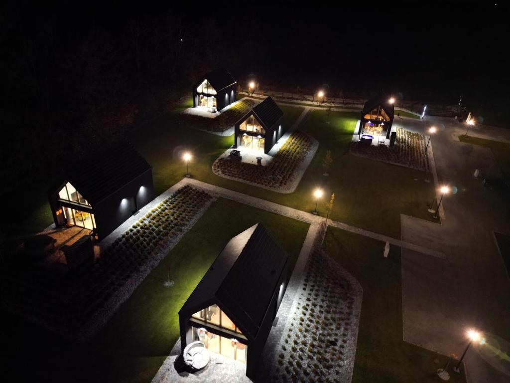 an aerial view of a building at night at Górskie Kąty Resort Michałkowa in Michałkowa