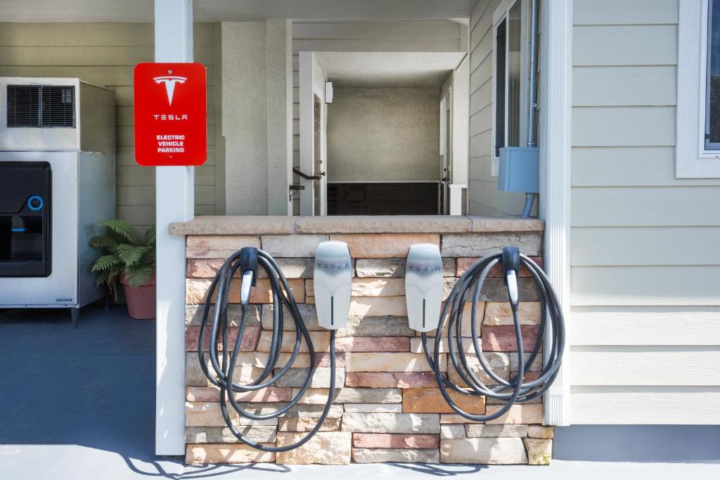 a front porch with a fence with two pay phones at Super 8 by Wyndham Fortuna in Fortuna