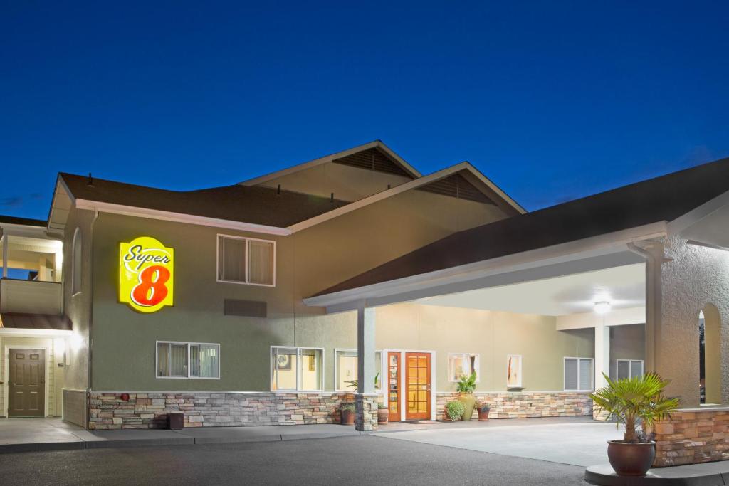 a rendering of a hotel with a sign on it at Super 8 by Wyndham Fortuna in Fortuna