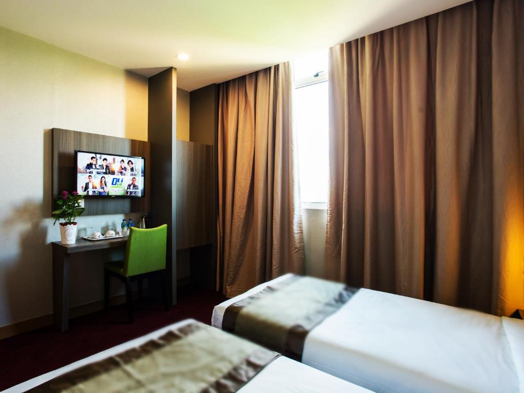 Postel nebo postele na pokoji v ubytování LS Hotel
