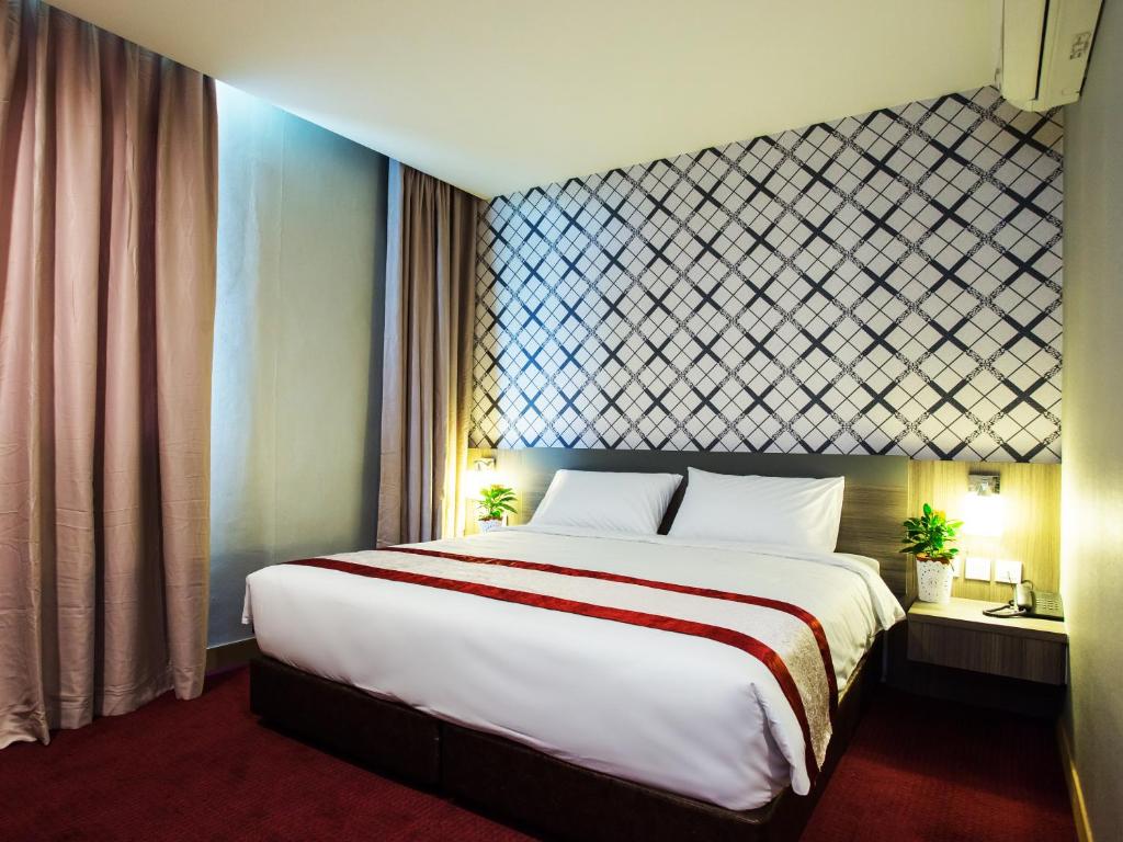 Postel nebo postele na pokoji v ubytování LS Hotel