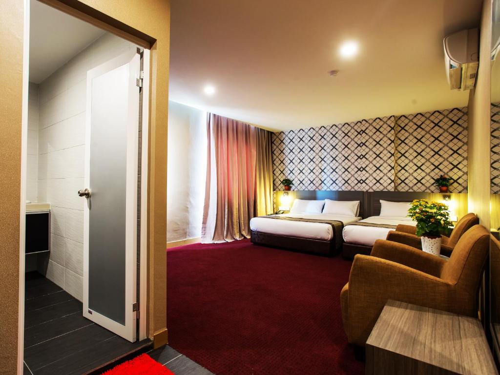 Postel nebo postele na pokoji v ubytování LS Hotel