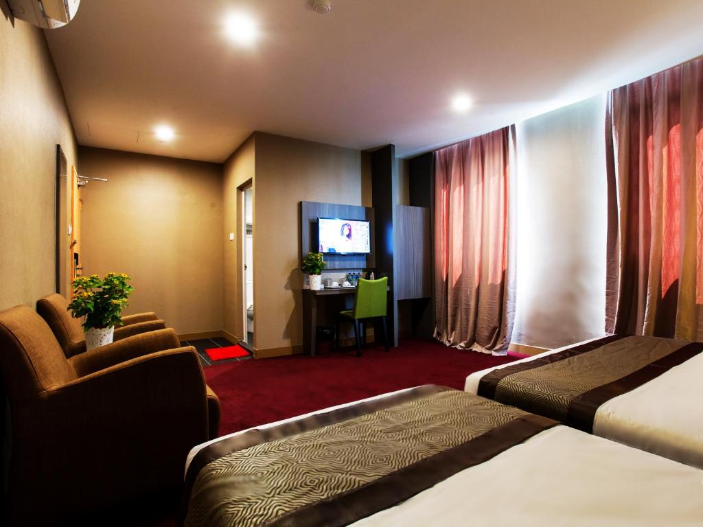 Postel nebo postele na pokoji v ubytování LS Hotel