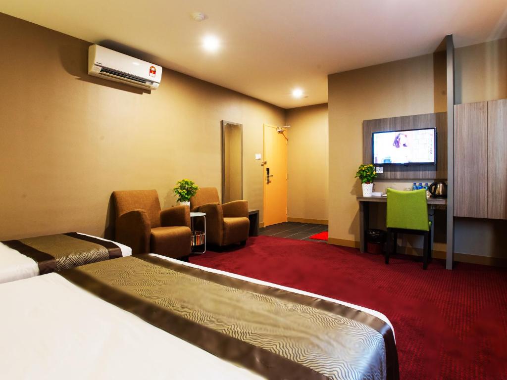 Postel nebo postele na pokoji v ubytování LS Hotel