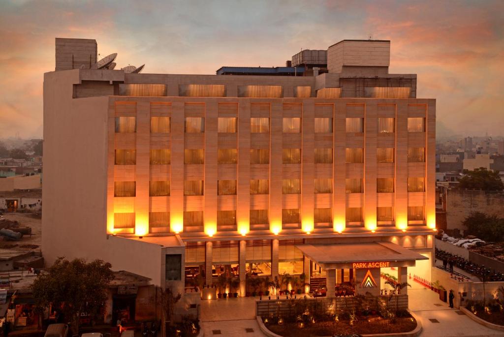 a large building with lights in front of it at Park Ascent in Noida