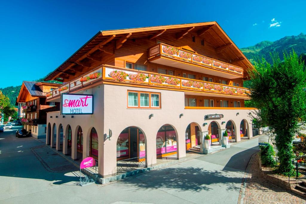 a large building with a sign on the side of it at smartHOTEL in Dorfgastein