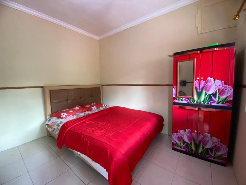 Ένα ή περισσότερα κρεβάτια σε δωμάτιο στο Poeri Sang Begawan