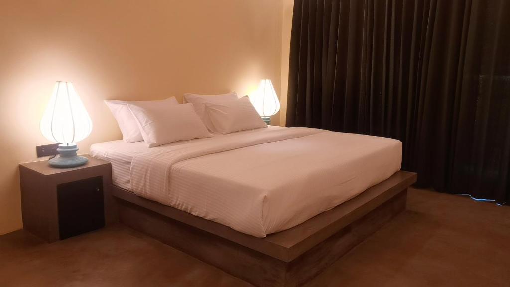 Ένα ή περισσότερα κρεβάτια σε δωμάτιο στο Thidasa Serenity