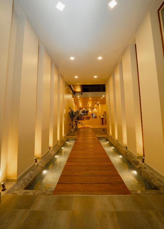 a hallway of a building with a long corridor at Emerald Resort Hikkaduwa in Hikkaduwa