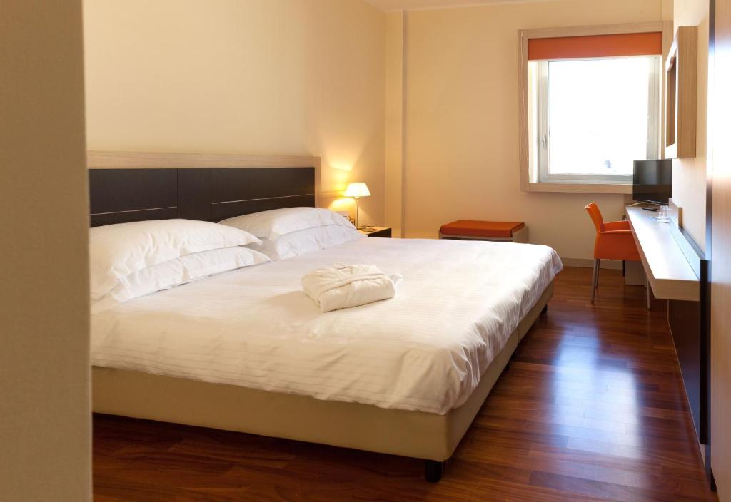 Postel nebo postele na pokoji v ubytování BV President Hotel