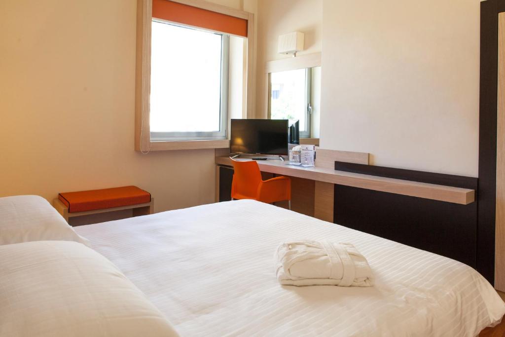 Postel nebo postele na pokoji v ubytování BV President Hotel