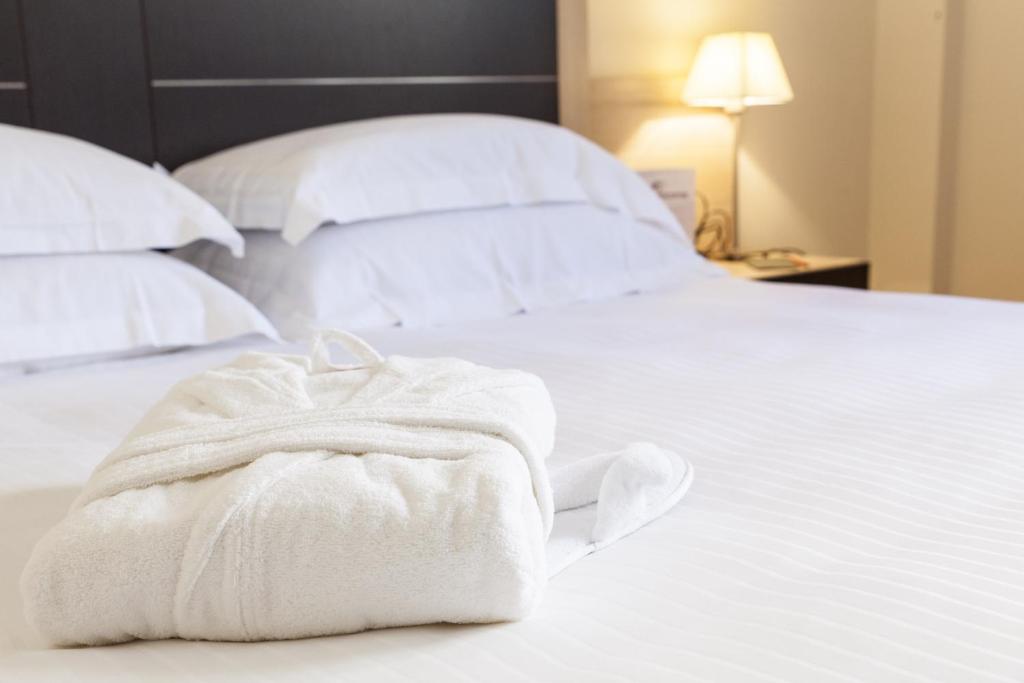 Postel nebo postele na pokoji v ubytování BV President Hotel