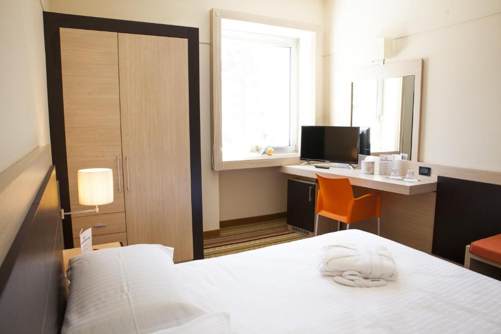 Postel nebo postele na pokoji v ubytování BV President Hotel