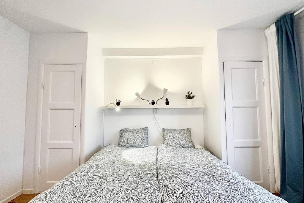 Ένα ή περισσότερα κρεβάτια σε δωμάτιο στο Family & Worker Accommodations in Göteborg