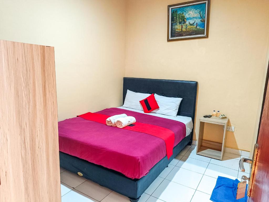 Una cama o camas en una habitación de The Legian 777