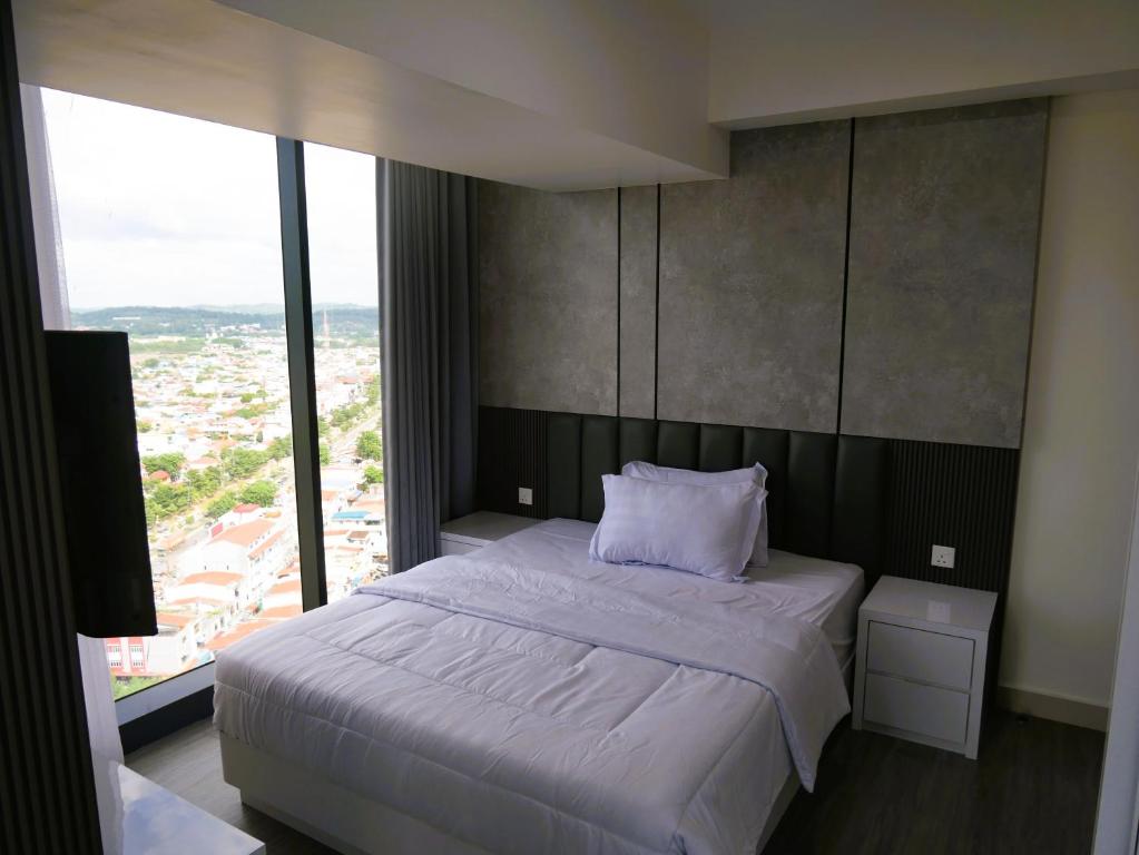 Ένα ή περισσότερα κρεβάτια σε δωμάτιο στο Pollux Habibie Apartment Batam