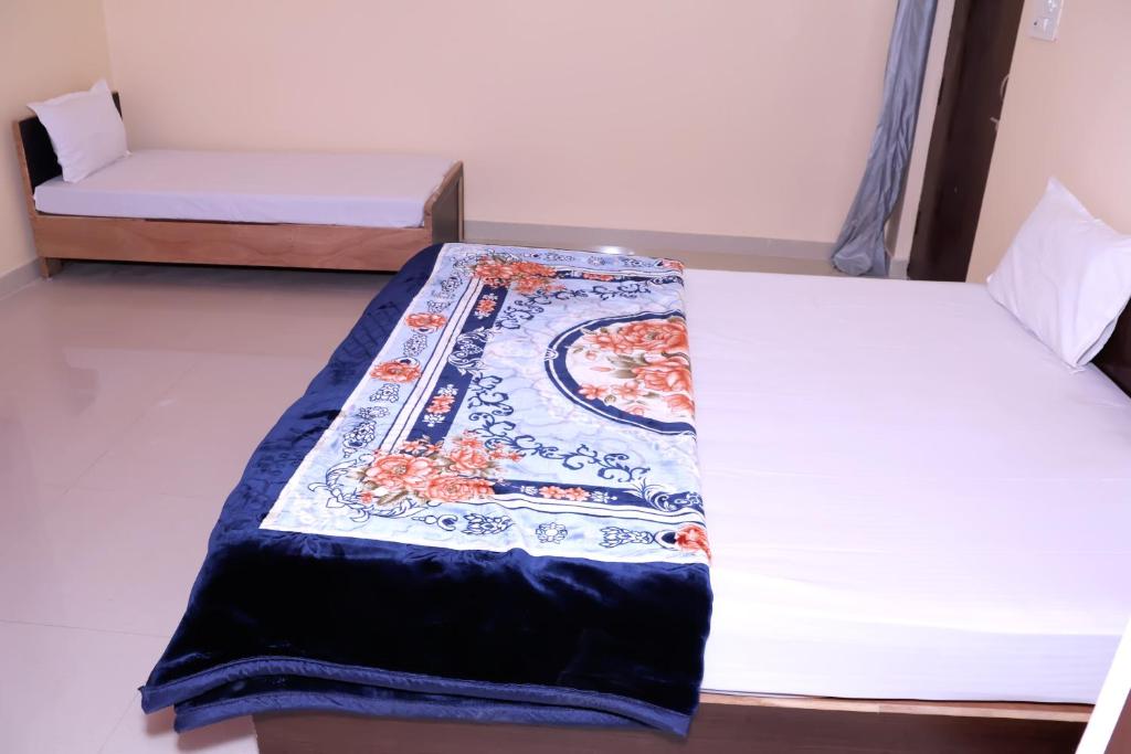 Postel nebo postele na pokoji v ubytování Hostel Home Stay Khajurhao