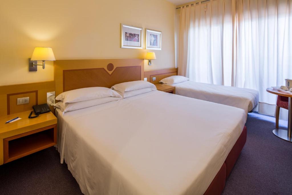 Posteľ alebo postele v izbe v ubytovaní Best Western Hotel I Triangoli