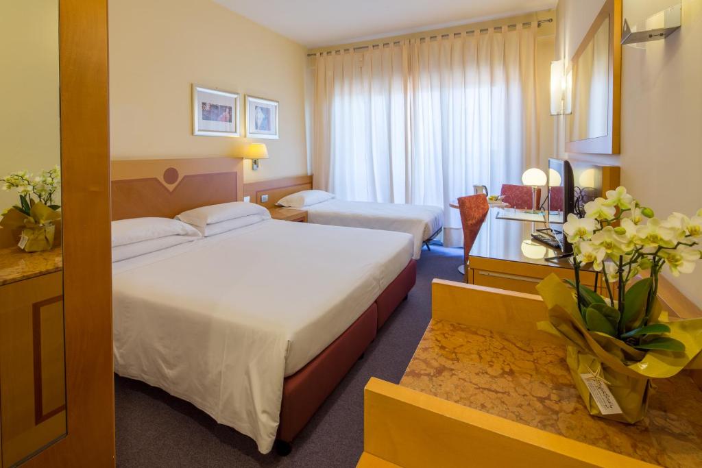 Posteľ alebo postele v izbe v ubytovaní Best Western Hotel I Triangoli
