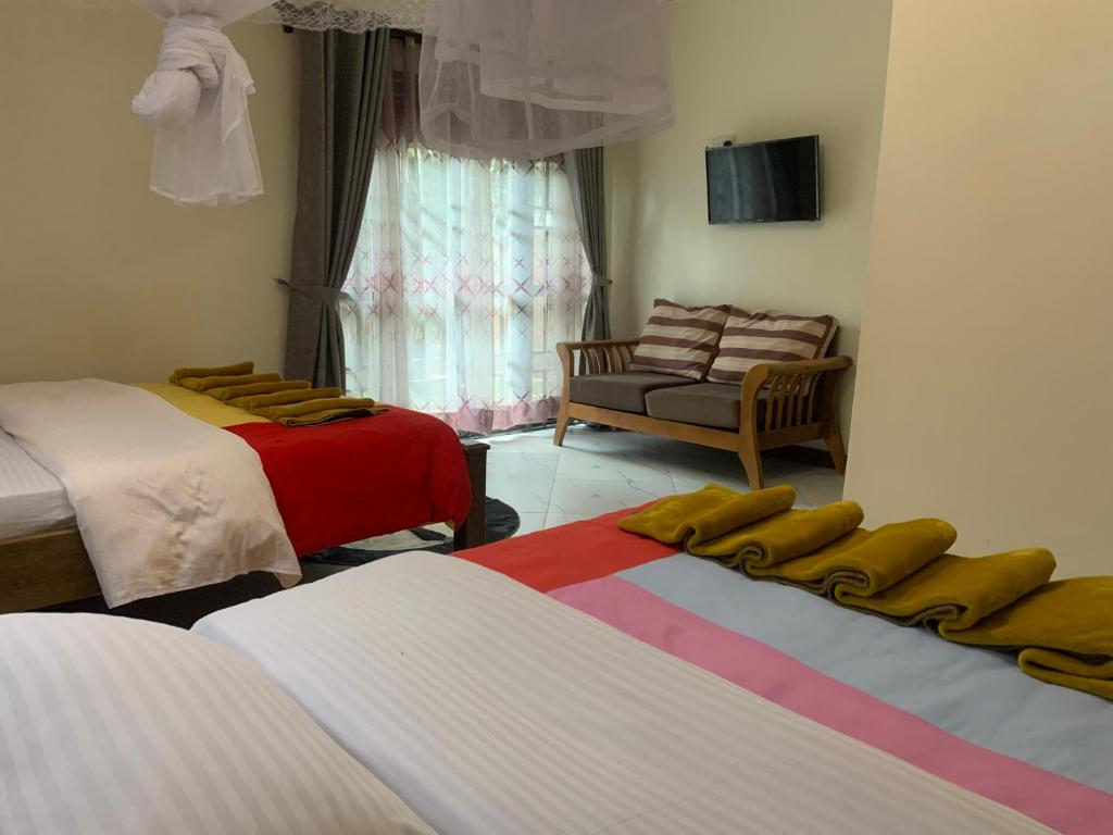 Postel nebo postele na pokoji v ubytování Montane Safaris Hotel FortPortal