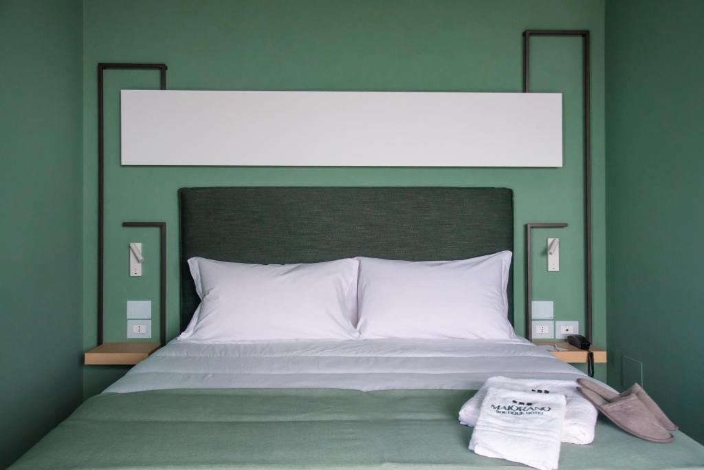 Giường trong phòng chung tại Maiorano boutique hotel