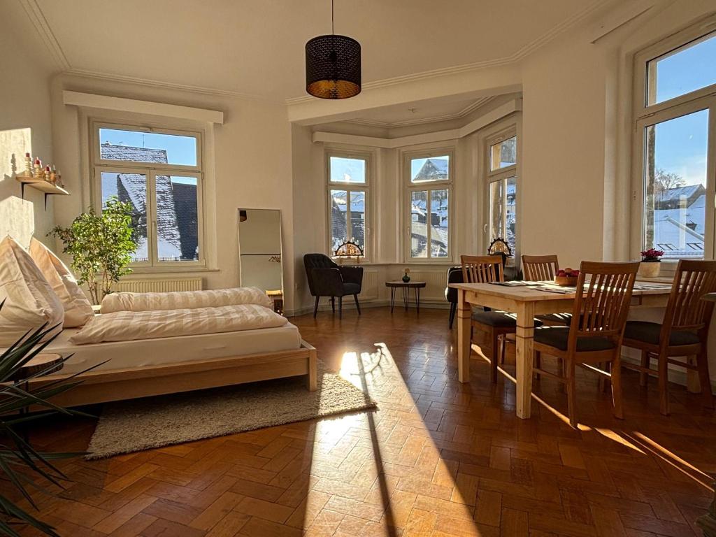 a living room with a couch and a table at Altstadt Studio Sankt Annenblick in Annaberg-Buchholz