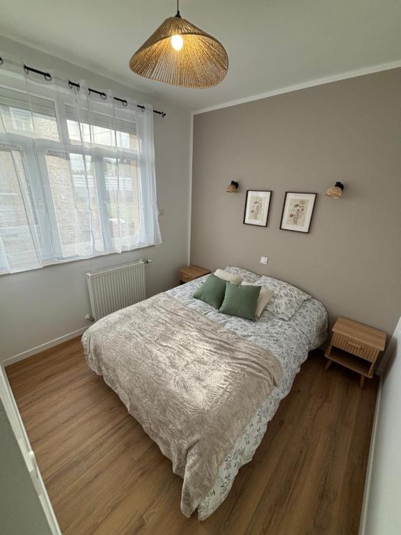 Voodi või voodid majutusasutuse Les meublés de l Etoile toas