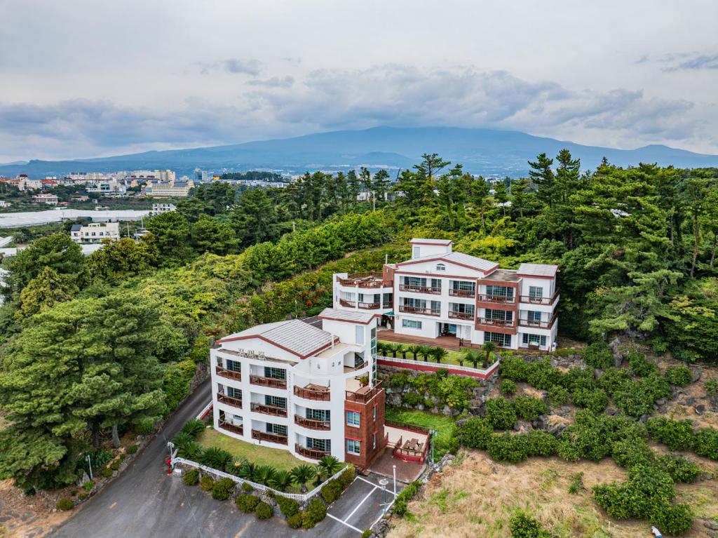 an aerial view of an apartment building at Four Season Pension in Seogwipo