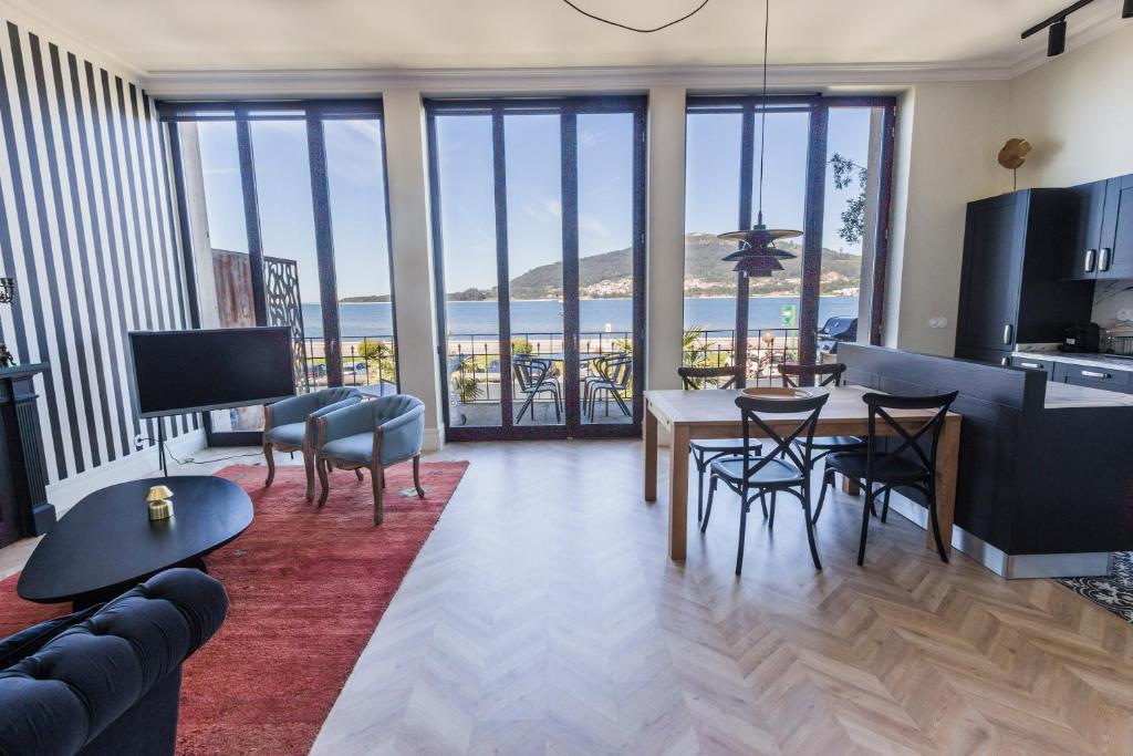 a living room with a view of the ocean at Santa Tecla - Safira in Caminha
