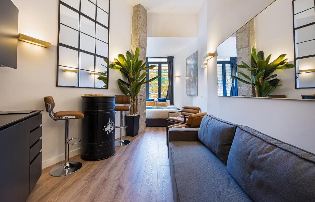 a living room with a couch and a table at ºIM La Latina-City Centre-WiFi-AC-SmartTVº in Madrid