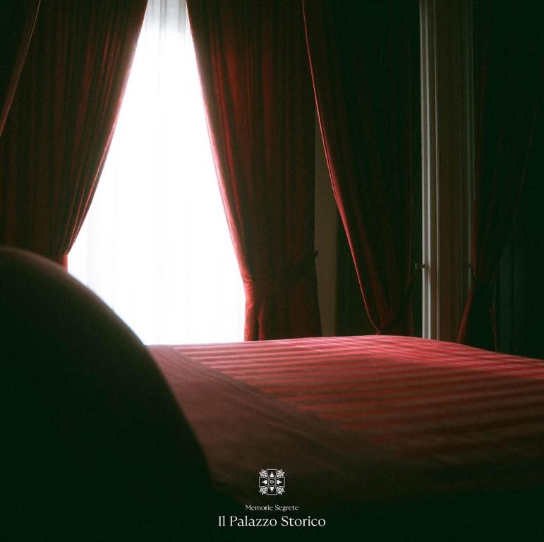 Giường trong phòng chung tại Palazzo Pecci