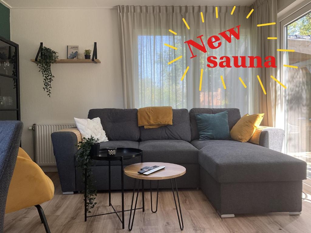 Et opholdsområde på Chalet Aan de rand - Veluwe - met sauna