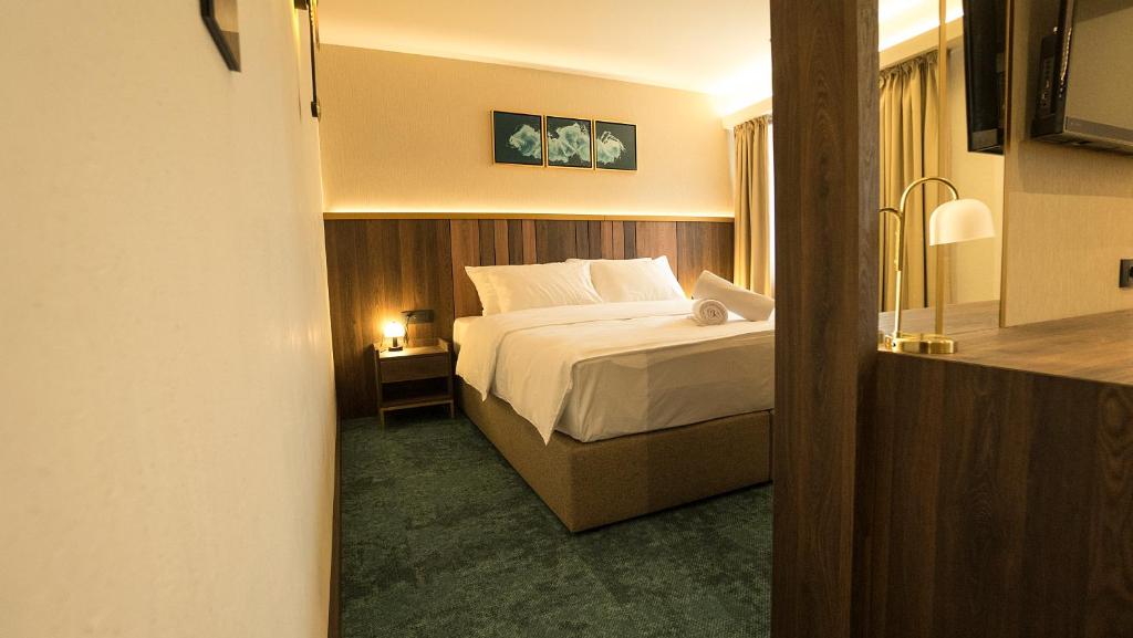 Ένα ή περισσότερα κρεβάτια σε δωμάτιο στο Hotel Central