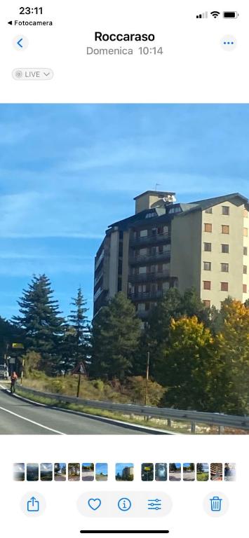 a picture of a building with a bus in front of it at Relax House in Roccaraso