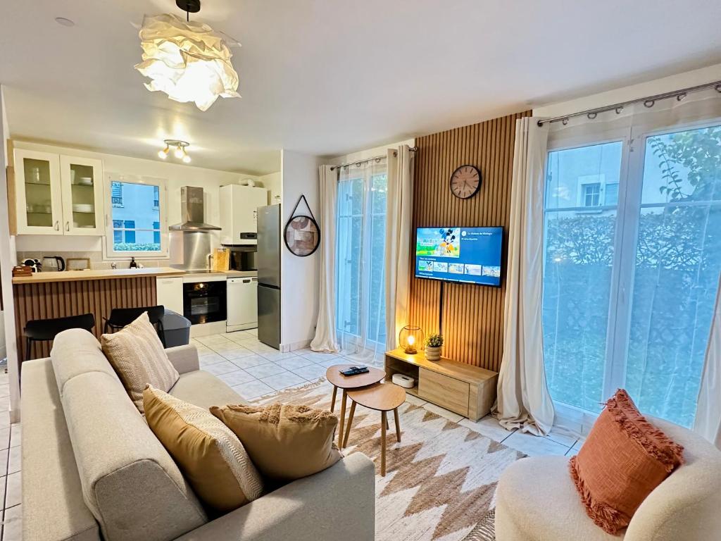 Kuchyň nebo kuchyňský kout v ubytování Maison Le A, à 2 pas de Disneyland