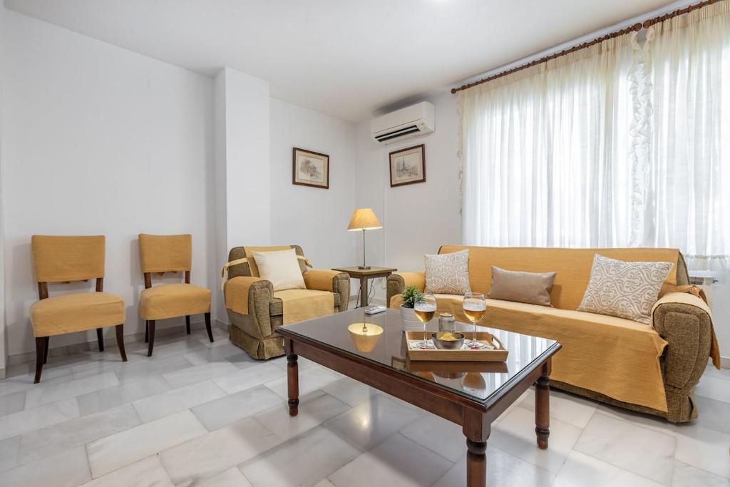 a living room with a couch and a table at Inspiration and Comfort near Pts and Fermasa in Armilla