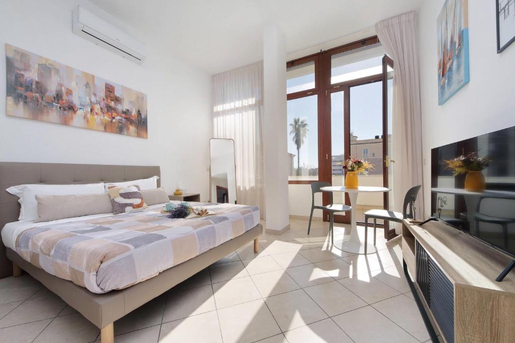 Ένα ή περισσότερα κρεβάτια σε δωμάτιο στο Fiumicino View - Casa Centrale e Tranquilla