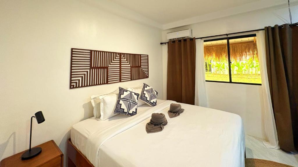 Postel nebo postele na pokoji v ubytování Villa Aniani