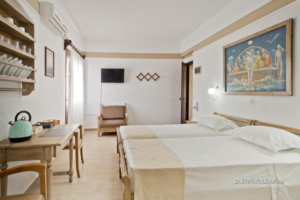 Postel nebo postele na pokoji v ubytování Philoxenia Studios