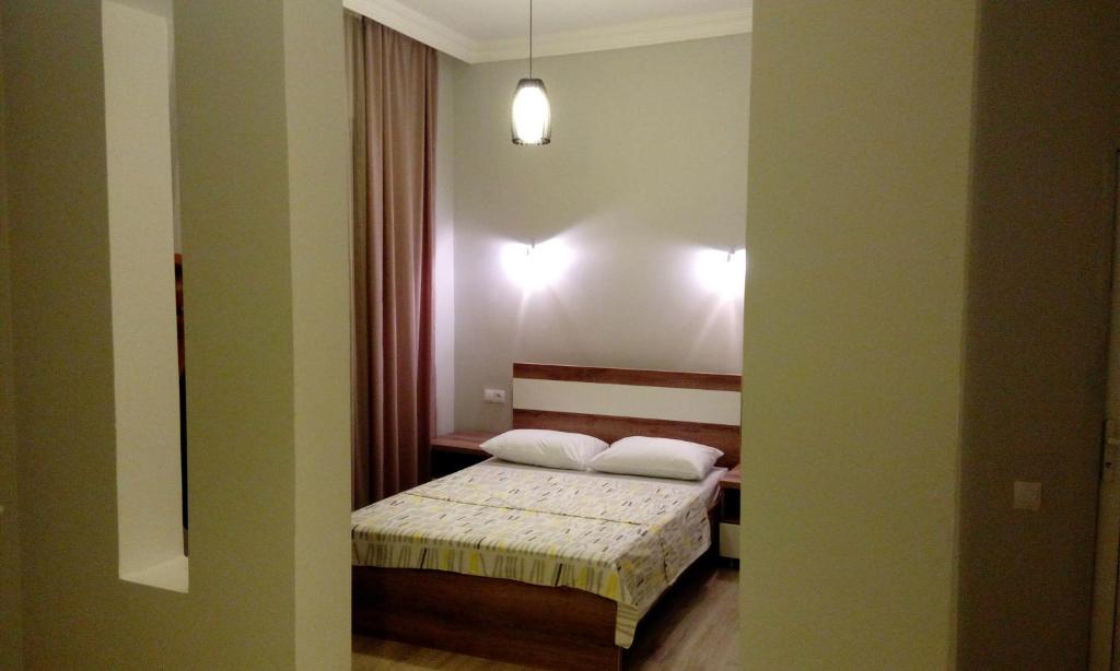 Postel nebo postele na pokoji v ubytování Old Street Guesthouse