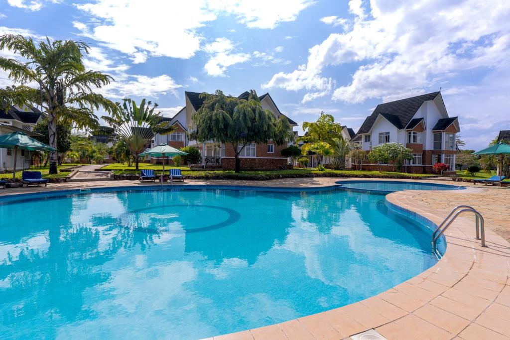 Swimmingpoolen hos eller tæt på Villas At Blue Water Diani